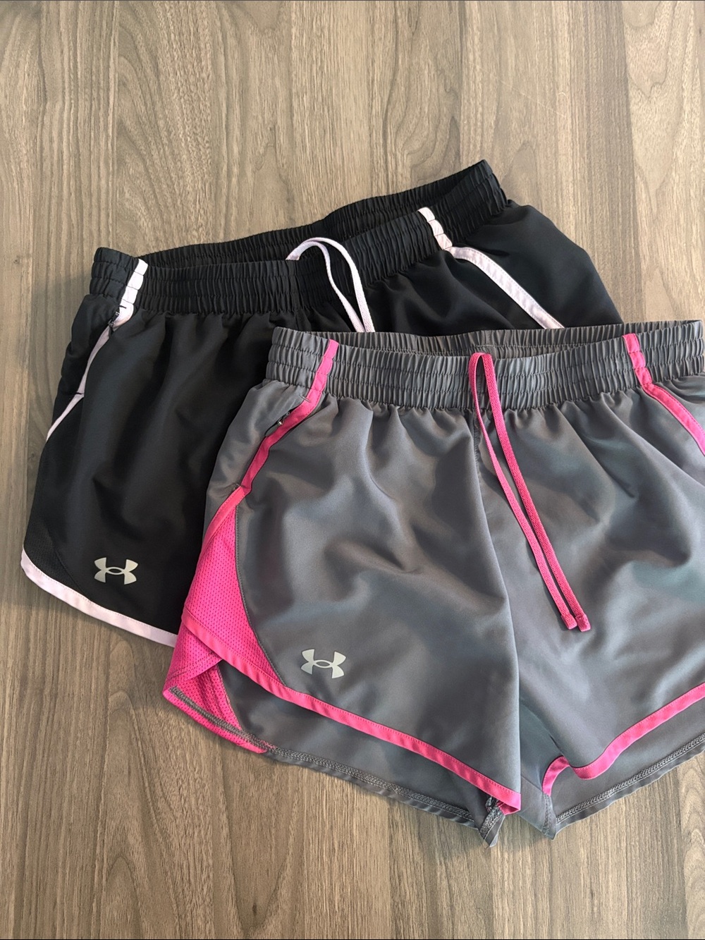 2 pairs. Under Armour Women's Athletic Shorts — Black/light pink & Gray/Pink